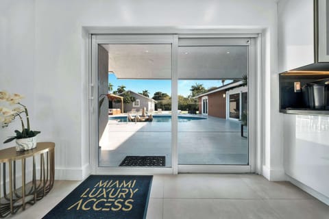 Seamless indoor-outdoor living with direct pool access.