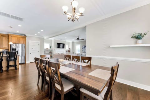 Dining area with a view of kitchen and living room.