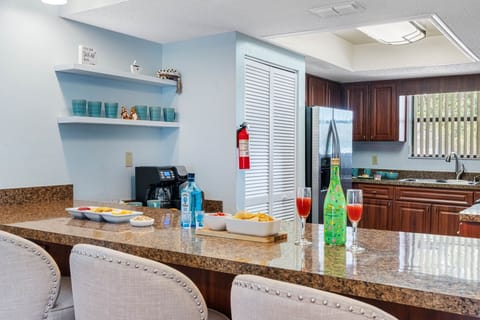 The countertops are made from gorgeous granite, offering a durable and heat-resistant surface for meal prep.