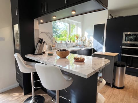 A place to help chef - if not by chopping onions, then by pouring them a drink!