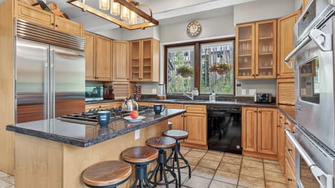 Kitchen, Main Level - With island bar stools