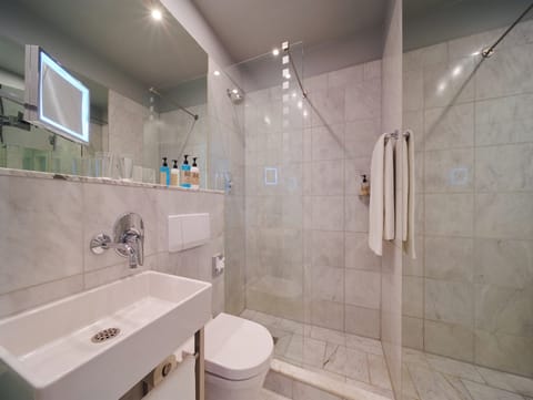 Eco-friendly toiletries, hair dryer, heated floors, towels