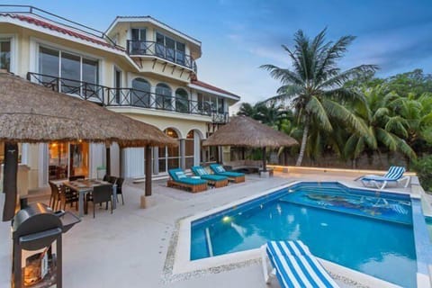 Grand view of this spectacular villa with outdoor sitting areas.