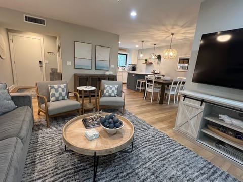 Gather for memorable meals in this bright, open dining area featuring modern coastal decor.