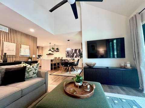 Enjoy the seamless flow of open-concept living, moving easily from the comfortable lounge area to the stylish dining space and kitchen.