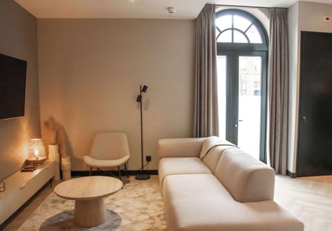 Open-plan comfort in neutral tones
Flow seamlessly from living to dining in this calm, curated interior.

