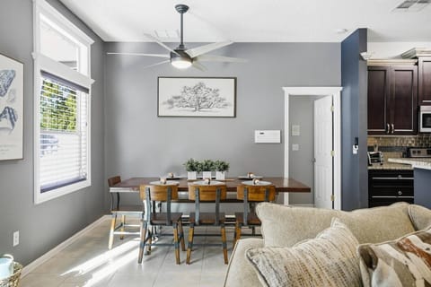 Bright dining area with seating for 7, offering pool and lanai views for relaxed, indoor-outdoor living.