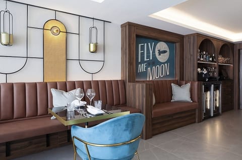 Gather over cocktails in a stylish, warmly lit lounge.