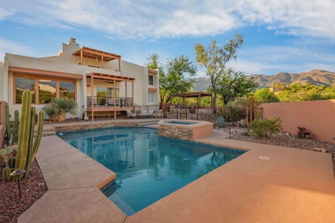 A private pool and hot tub, with optional heating, set against a gorgeous desert and mountain backdrop.