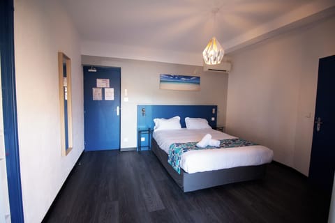 Stretch out comfortably in a modern room with calming tones.