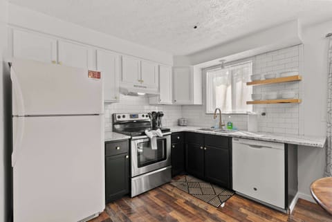 The sleek eat-in kitchen offers ample space & all the comforts of home​