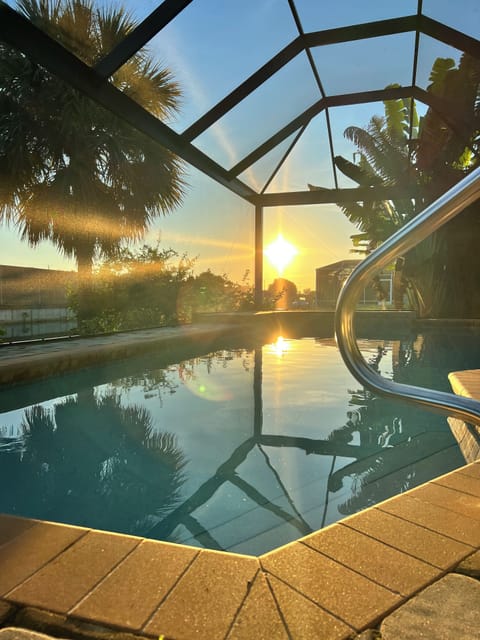 Large inground private heated pool over looking the water