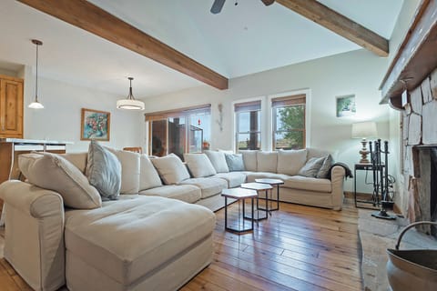 Large open plan great room with real wood fire