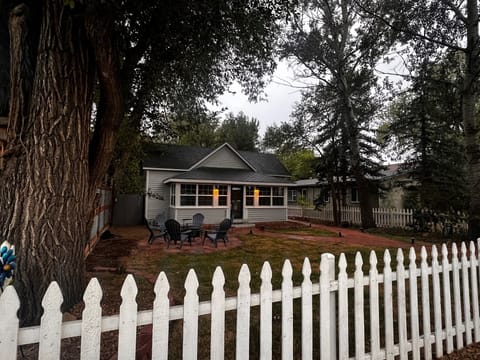Front of home.  Enclosed 3 season patio with firepit patio