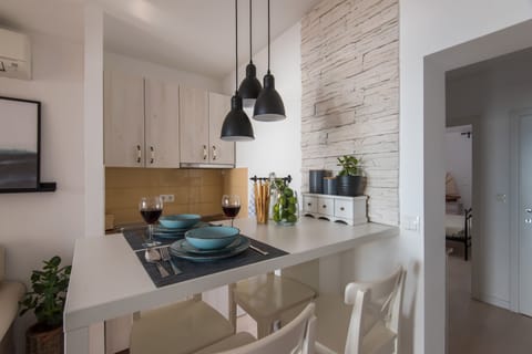 Exclusive Apartment, 1 Bedroom, Sea View | Private kitchen | Full-size fridge, microwave, coffee/tea maker, electric kettle