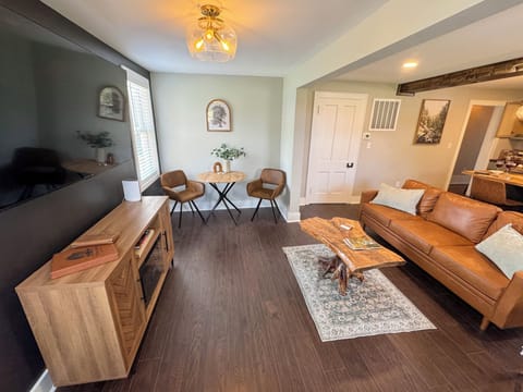 Stylish Open Concept Living Room with Smart TV and electric fireplace