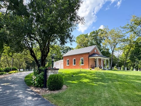 Gorgeous large yard for the doggies and front porch seating to enjoy the views and slow mornings at Pikes Peak Schoolhouse.