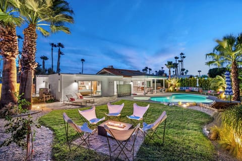 Full backyard view with fire pit, pool & mountain backdrop