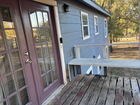 Balcony and entrance to upstairs apartment