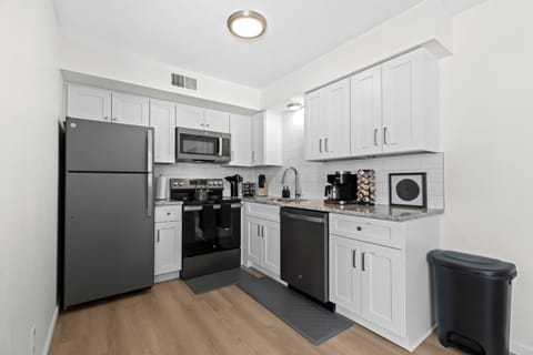 Cook with ease in a sleek, modern kitchen complete with stainless steel appliances, ample counter space, and all the essentials.