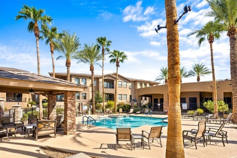 Your desert oasis awaits! Dive into resort-style living with this stunning pool, sunny skies, and palm trees for days. Who needs a filter when your view looks like this? Book your escape and let the good times roll!