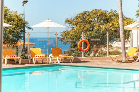 Bask in breezy comfort with loungers and sea-kissed views.