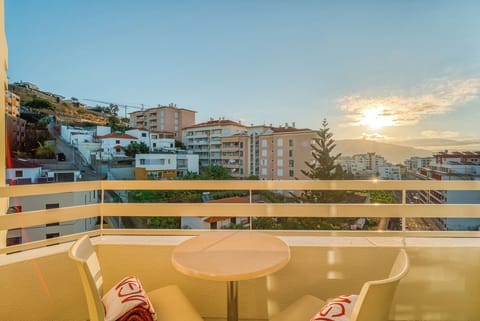 Toast sunset skies from your private balcony table for two.