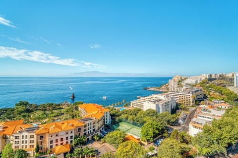 Soak in panoramic ocean views over colorful coastal rooftops.