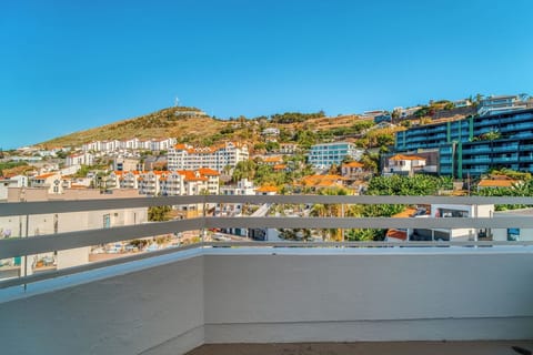 Take in hillside city vistas under bright blue skies.