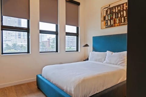
Cozy bedroom with natural light and plush bedding