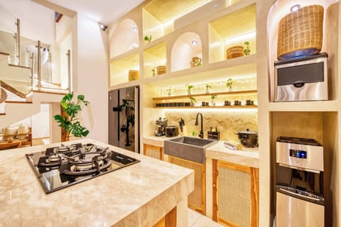 Gather, cook, and connect in a space where natural textures meet modern ease in the fully equiped kitchen