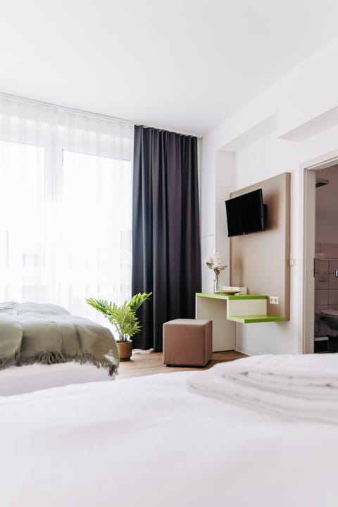 Premium bedding, desk, laptop workspace, free WiFi