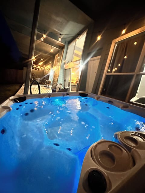 Backyard deck and hot tub in the evening