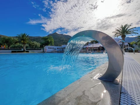 Seasonal outdoor pool, open 11:00 AM to 7:00 PM, sun loungers