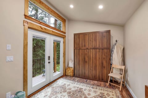 The Murphy bed can be tucked away during the day for added space