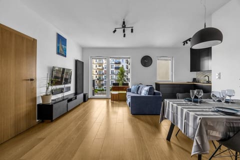 Living Room with Sofa, Smart TV and Dining Table | Book Now with RENTUJEMY.COM