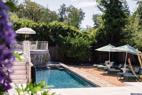 Outdoor space featuring a pool and comfortable lounge area.