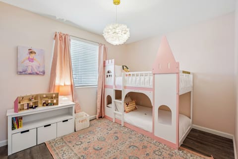 This adorable princess room is a special touch for the little ones. They will love the castle-style bunk beds