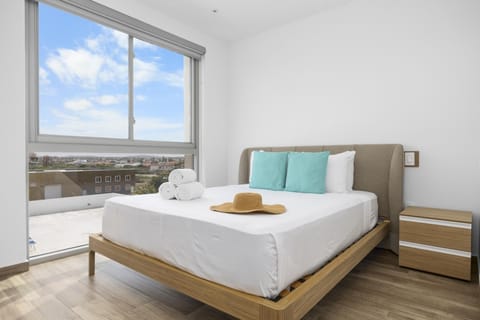 Settle into comfort! This charming bedroom offers a plush Queen bed, cool AC, a TV for unwinding, and generous clothing storage. Plus, a large window brings the beautiful outside views right to you.