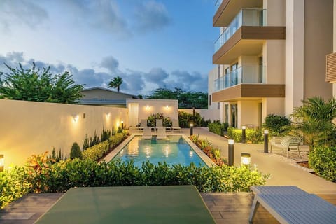 Dive into the night with our beautifully lit pool — where every evening feels magical and inviting.