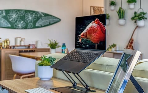 The work station in the living room is thoughtfully positioned to overlook the living room space.  
