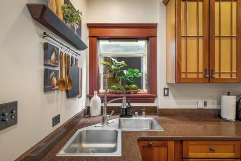 Enjoy a view while doing dishes in this warm and inviting kitchen space.