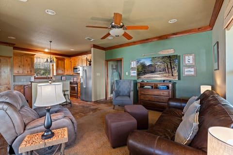 Living Area 2 | Warm Wood Accents | Comfortable Seating | Seamless Kitchen Access