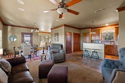 Living Area 2 | Warm Wood Accents | Comfortable Seating | Seamless Kitchen Access