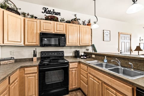 From morning coffee to gourmet dinners, this fully stocked kitchen is the heart of the home