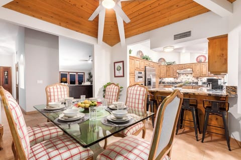Modern kitchen features counter  and table seating.