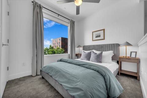 One-Bedroom with Queen Bed in a Modern Green, White & Grey Palette