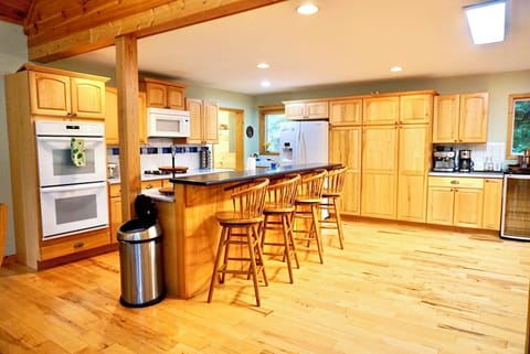 Kitchen: Modern amenities and ample seating make cooking a delightful adventure! Enjoy your stay!