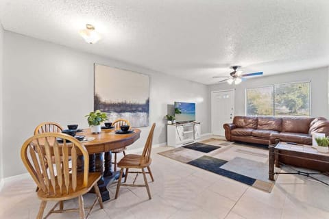 Living Room offers a comfortable sectional sofa to lounge in while watching the 55" Roku Smart TV. 