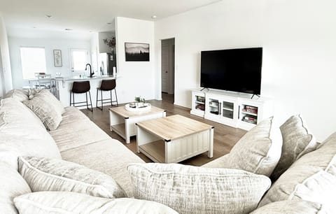 Living Room Bright and open living room with plenty of light. 70 in smart TV.